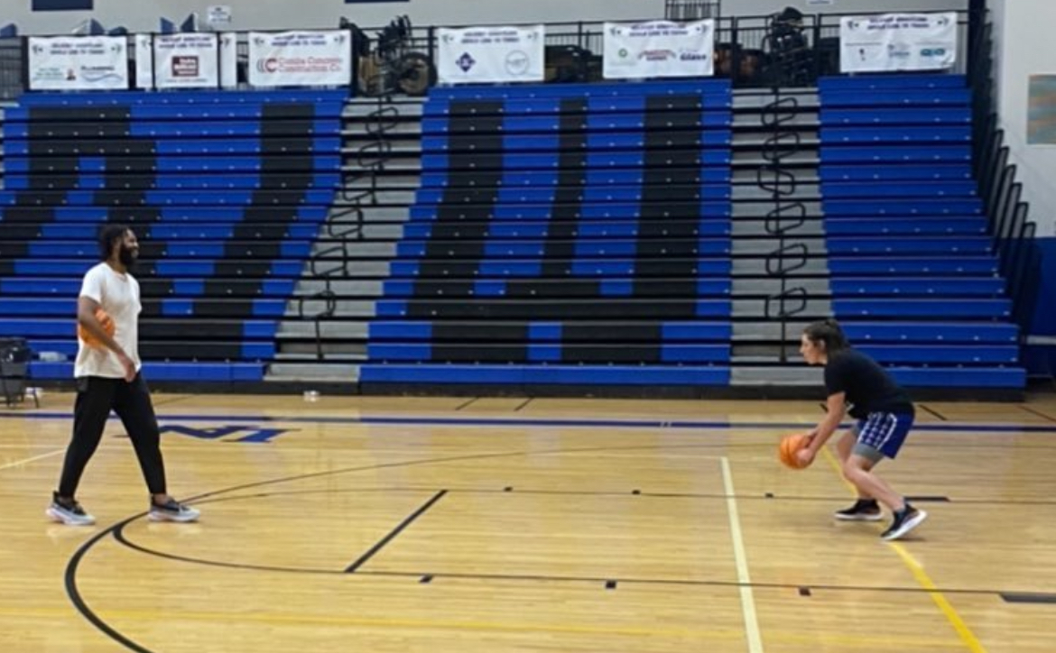 KiShawn Pritchett working one-on-one with an athlete in a gym
